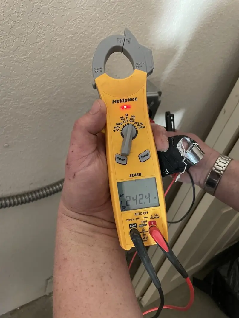 Voltage testing with clamp meter during Generator Installation in Feather Sound